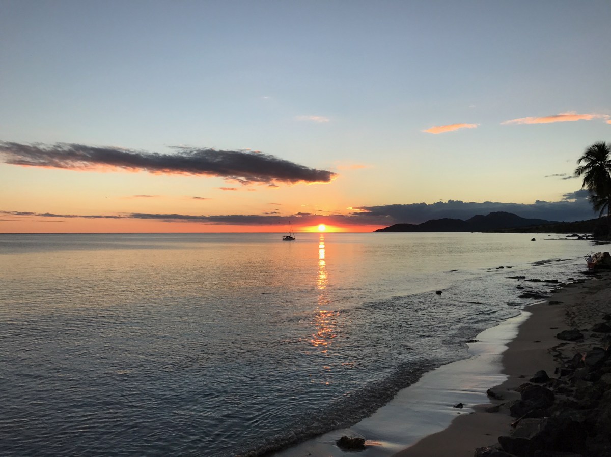 a sunset over a body of water